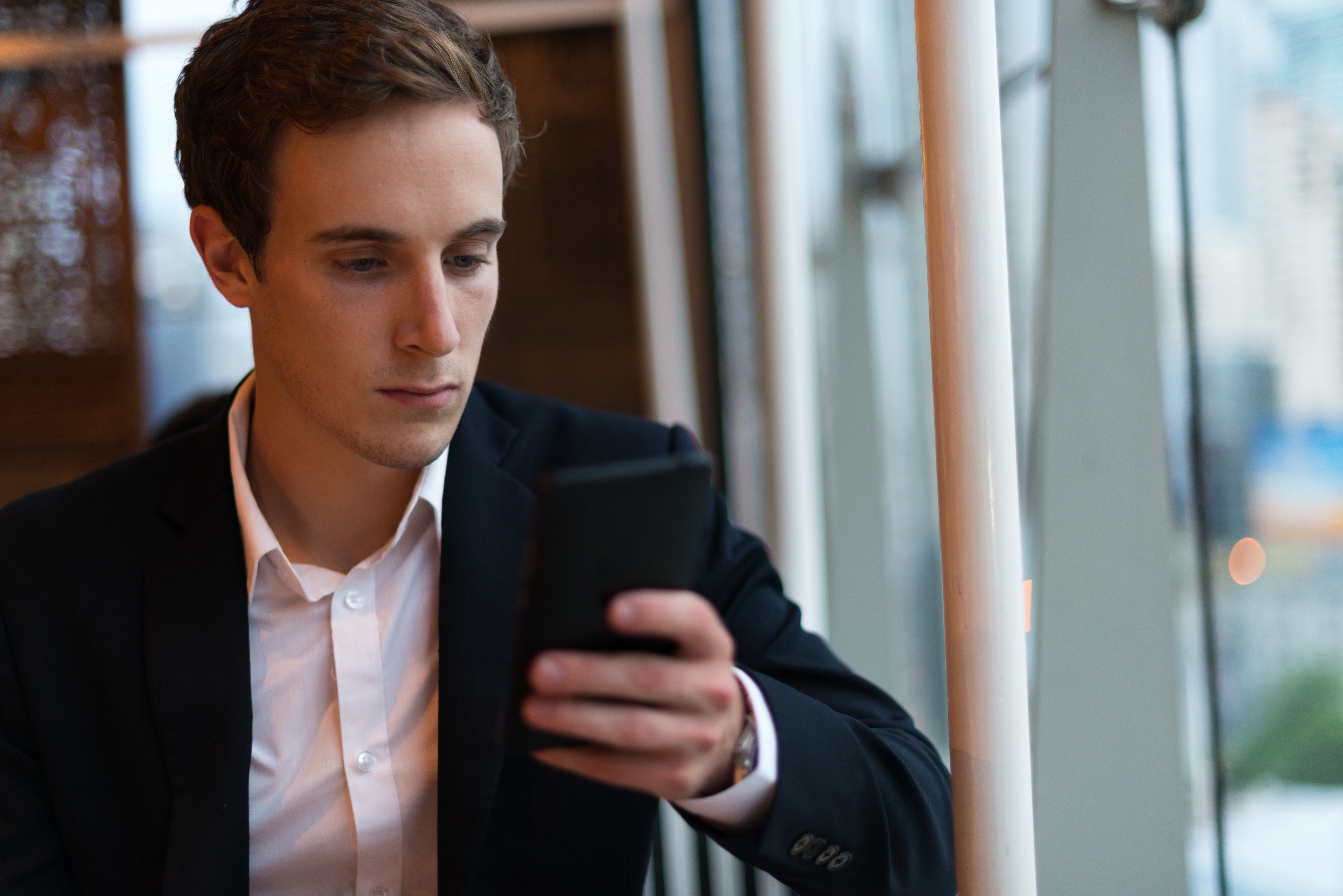 portrait-of-young-handsome-businessman-at-the-coff-2023-11-27-04-54-00-utc